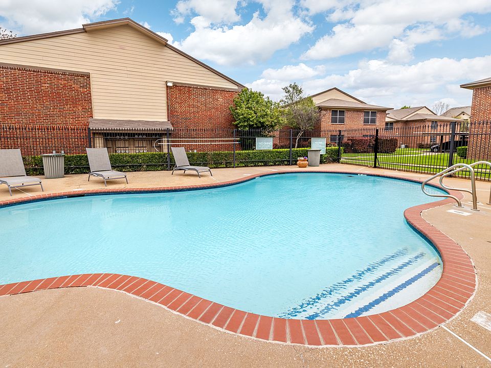 Inviting curved swimming pool with ample space for leisure and enjoyment