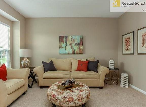 Formal Living room is open to the entry and across from the dini