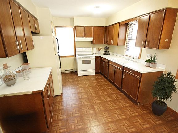 Plenty of cabinet space. Kitchen window above sink. Quality pergo flooring.
