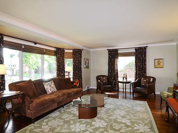 Living room has North, East & Western windows!