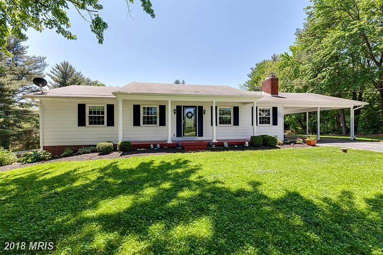 Mature landscaping lends shade to your front yard