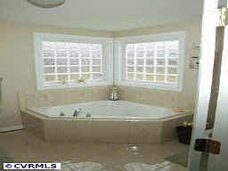 Master Bath with Ceramic Flrs and Surround