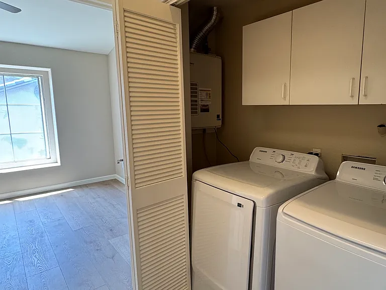 Laundry area with built-in hamper (not shown in photo)