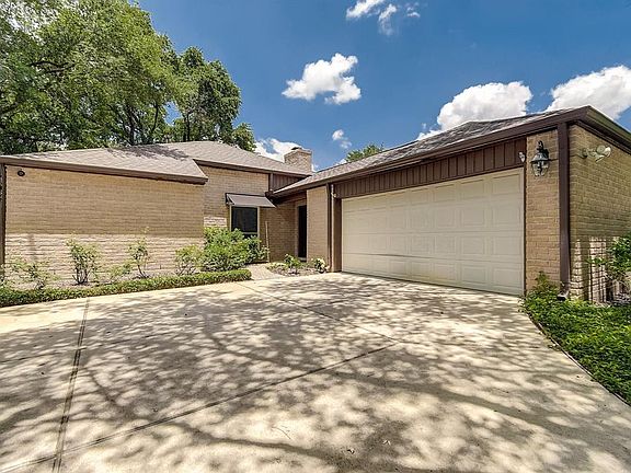 Closer up view of the front of the house located on a cul de sac street