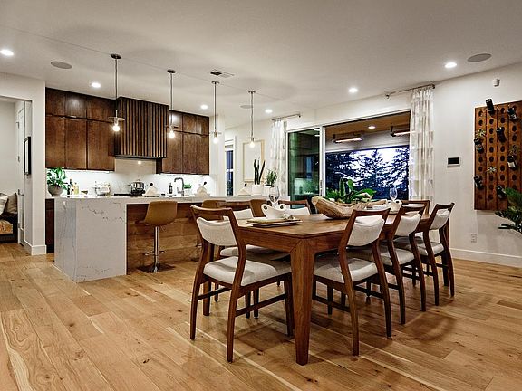 Open-concept floorplan with luxury covered deck off of the kitchen