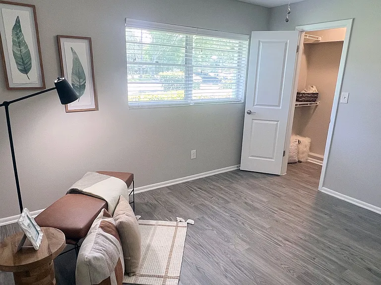 Spacious bedrooms featuring wood-style flooring, ample natural light, and a walk-in closet. This serene atmosphere is a perfect retreat for rest and relaxation.
