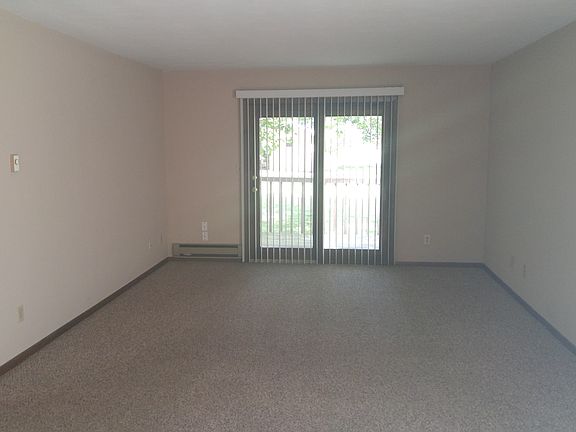 Large Living Room with Patio Door to the Outside Deck.