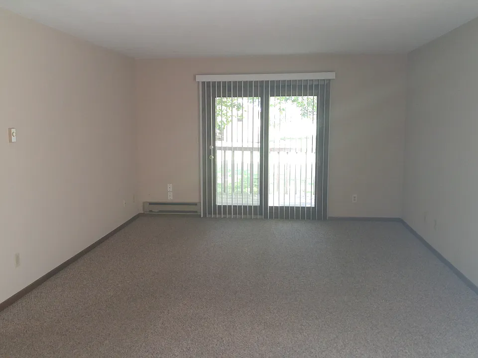 Large Living Room with Patio Door to the Outside Deck.
