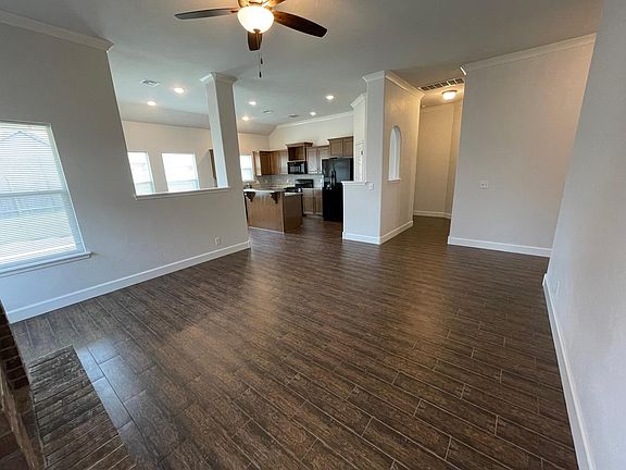 Open floor plan. View from living room into kitchen/dining area.