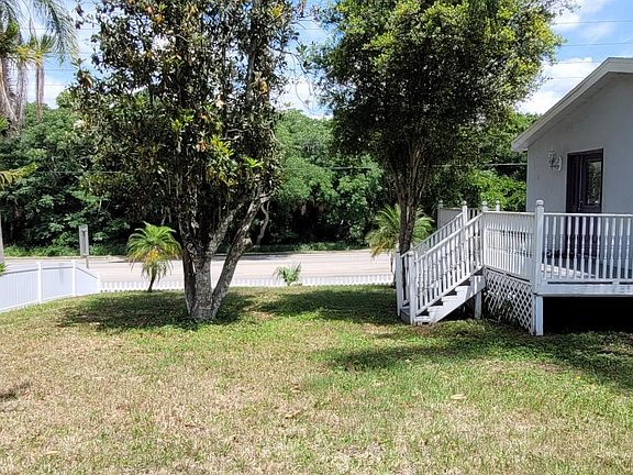 This your space for any outdoor furniture. Hammock, swing, patio set up. Sunbrella etc. 
Step and porch on the right, is the side entrance and exit to master bedroom.