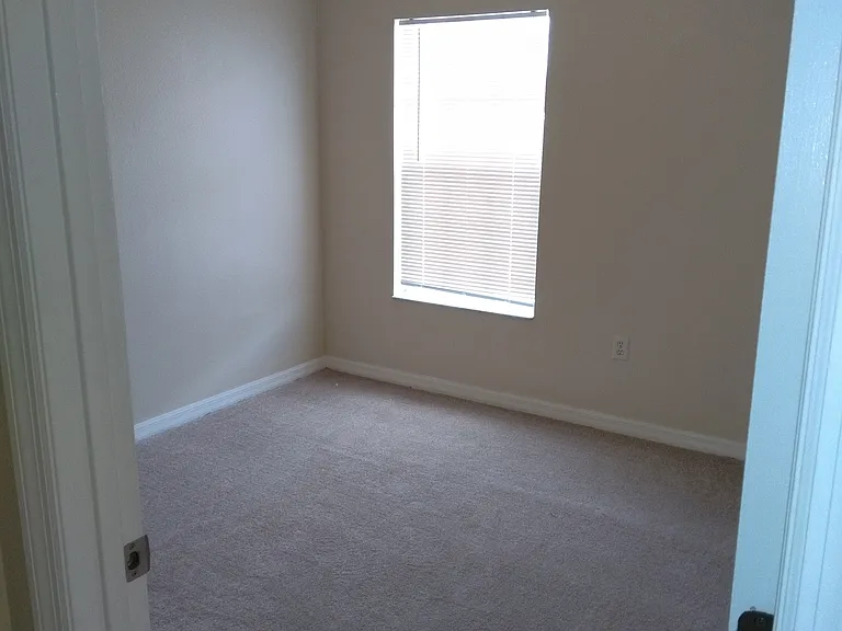 Sizable bedroom for young child or teenager.