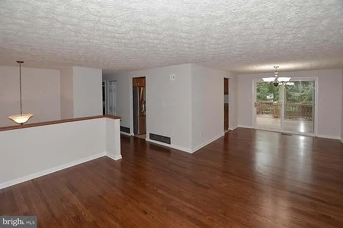 Living room & Dining rooms areas and door to the deck & backyard.