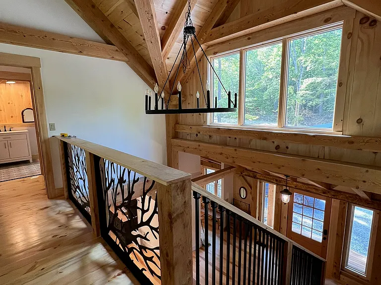 A catwalk connects the bedrooms on the top floor.
