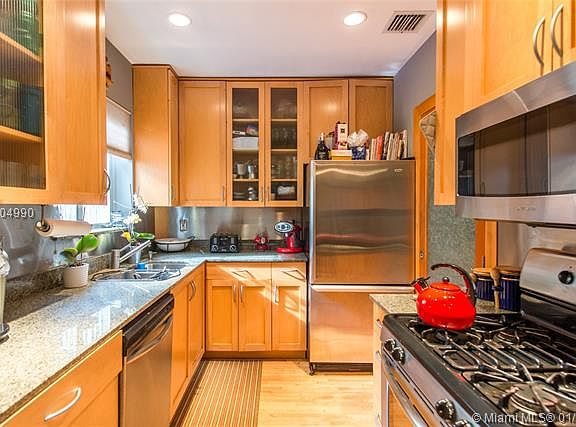 Charming bungalow on a quiet, tree-lined, cul-de-sac street in prestigious North Coconut Grove