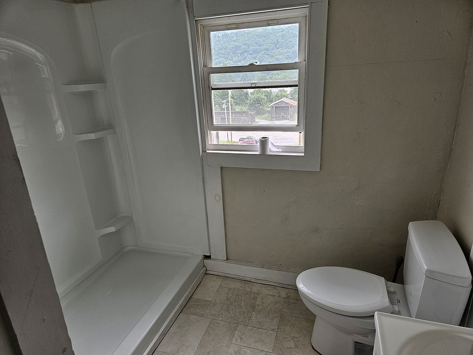 Extra large shower stall, new toilet and sink
