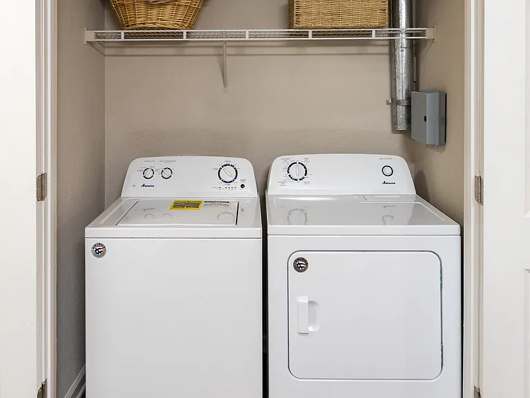Laundry room with full-size washer and dryer