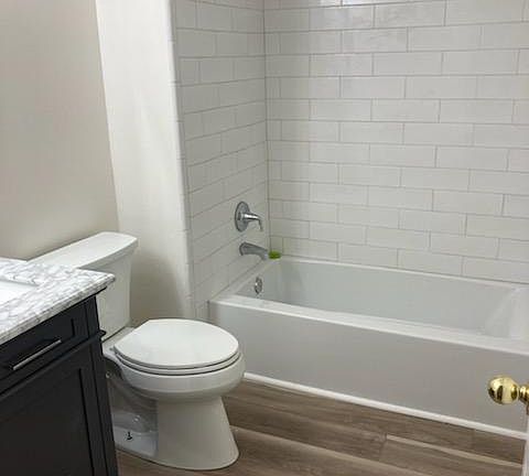 Beautiful subway tile shower with full size bathtub. The bathroom is completely updated with fresh paint and new fixtures.
