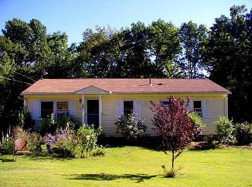 Large lot with large trees at the back