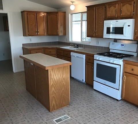 The spacious kitchen has plenty of room for multiple cooks and friends too.