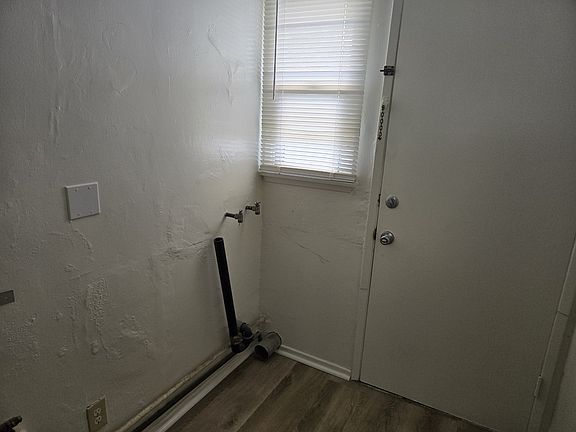 Utility Room with that will accomodate a stack system washer and gas dryer. There is a utility closest. The door leads to the rear yard.