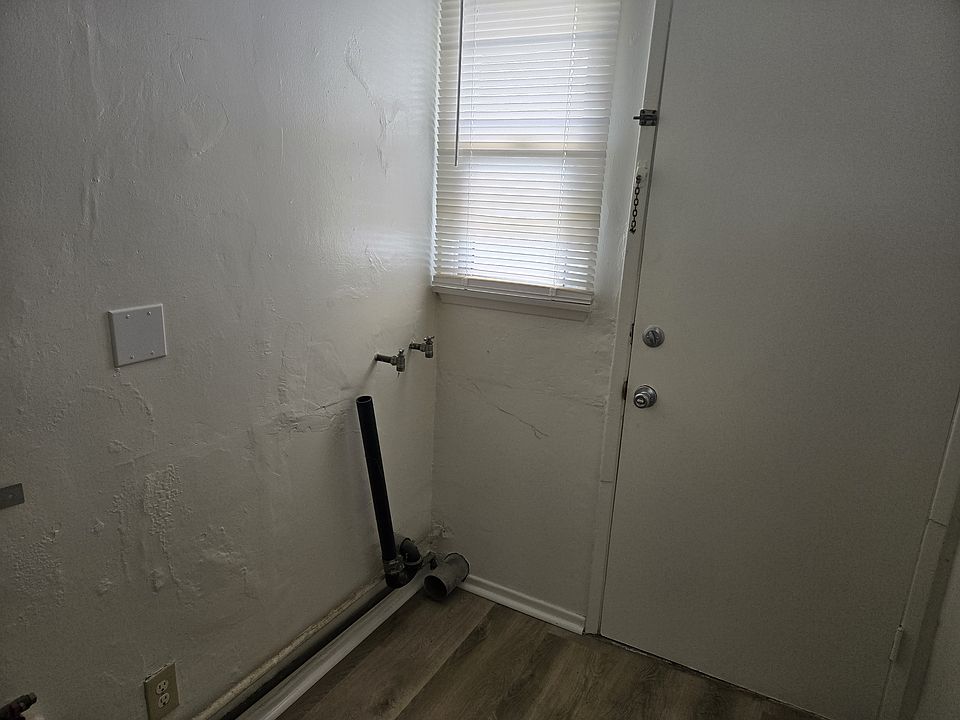 Utility Room with that will accomodate a stack system washer and gas dryer. There is a utility closest. The door leads to the rear yard.