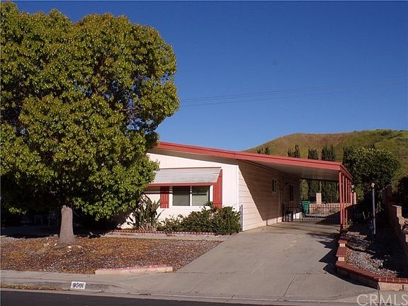 right side, long drive to the two car garage behind the home.