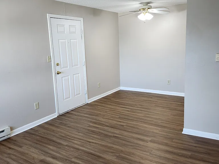 Walls have white paint in the available unit, but the same floors as pictured, and same layout.