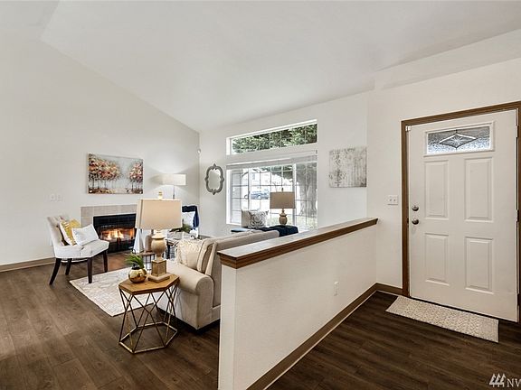 The entry foyers open into the grand and airy living room. 