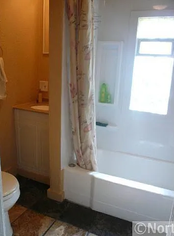 Full bathroom with new tile flooring