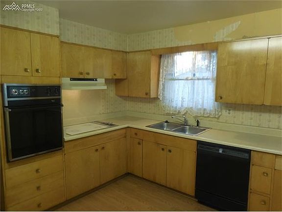 Another View of the Kitchen showing the cooktop stove, wall oven, and dishwasher