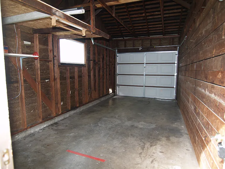 Room for 1 car plus storage shelving. You have your own driveway to park 1 car or get permit to park other car on street 24 hours per day.