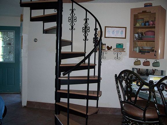 A spiral stairs that leads to...