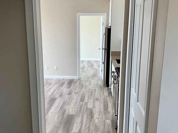 Entry way with pantry on right and washer/dryer closet on left