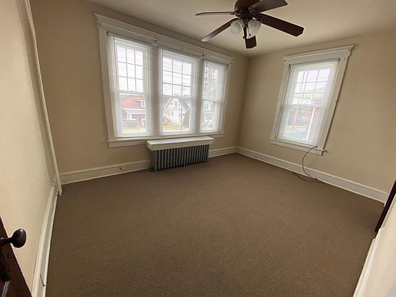 Bright front room with ceiling fan