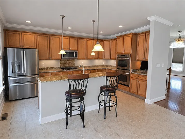 Kitchen with full stainless steel appliances.