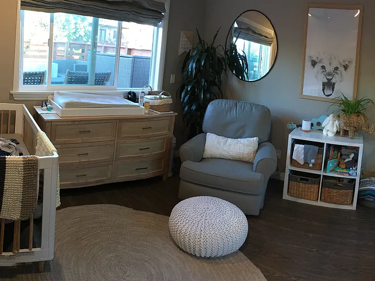 Second bedroom with mirrored closets and storage cabinets