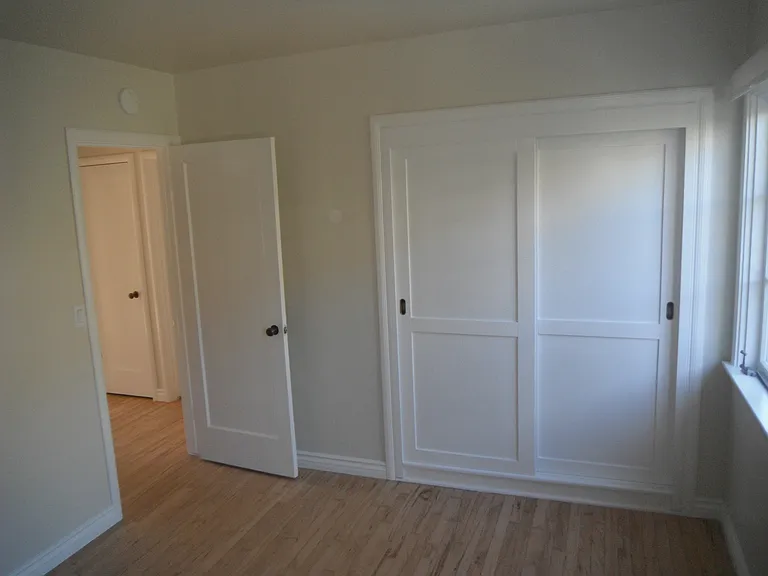 Bedroom with sliding closet doors
