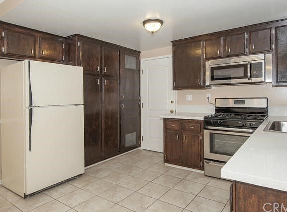 Upgraded Kitchen with New Quartz Countertops, New Stainless Appliances and Sink.