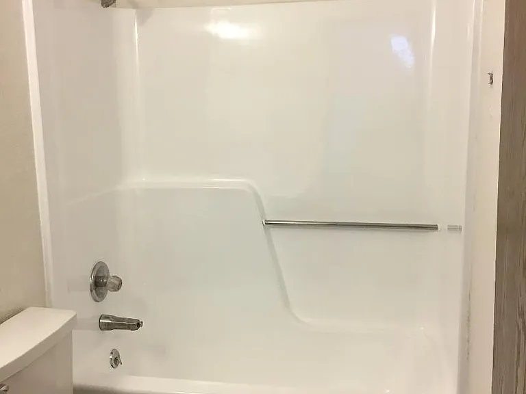 Bathroom with toilet, rub & shower