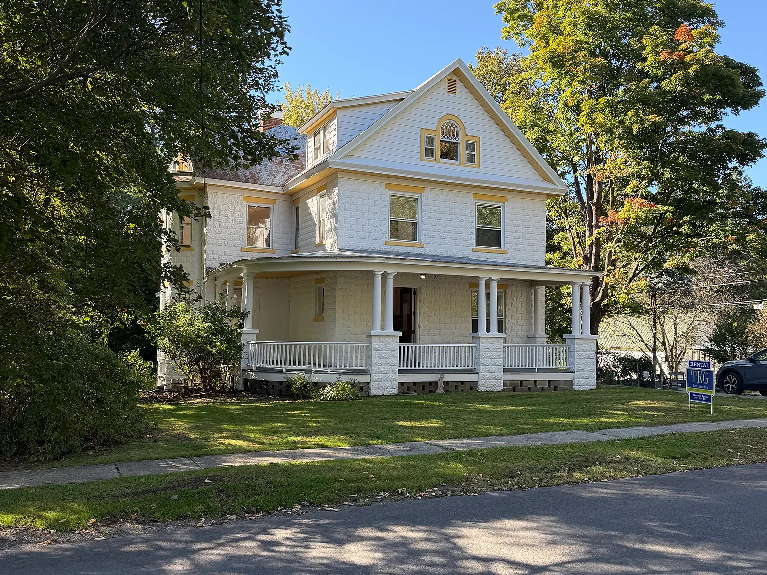 Front of building, showing the curved front porch