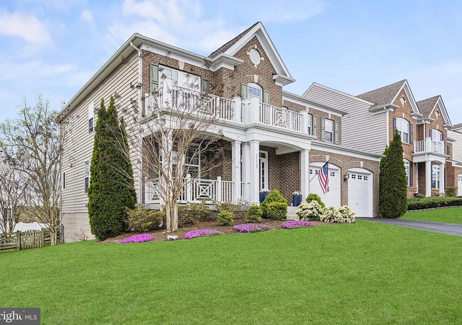 This beautifully maintained single-family home offers five bedrooms, four-and-a-half bathrooms, a... — Photo 2