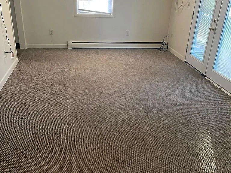 Living space with French doors to Patio