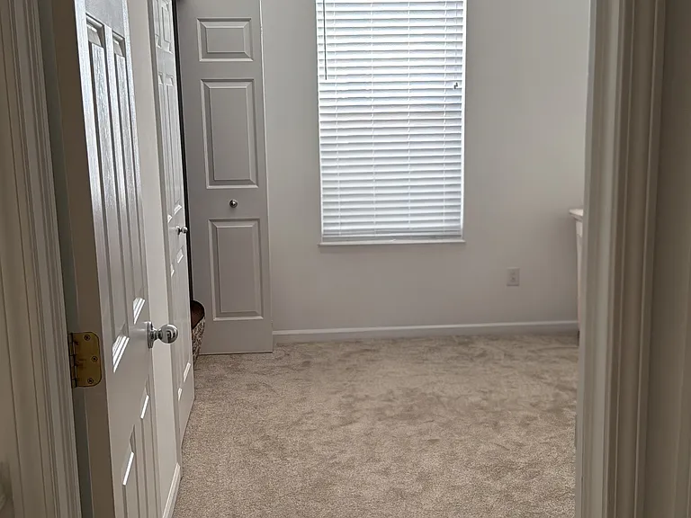 3rd/guest bedroom with an adjacent full bath