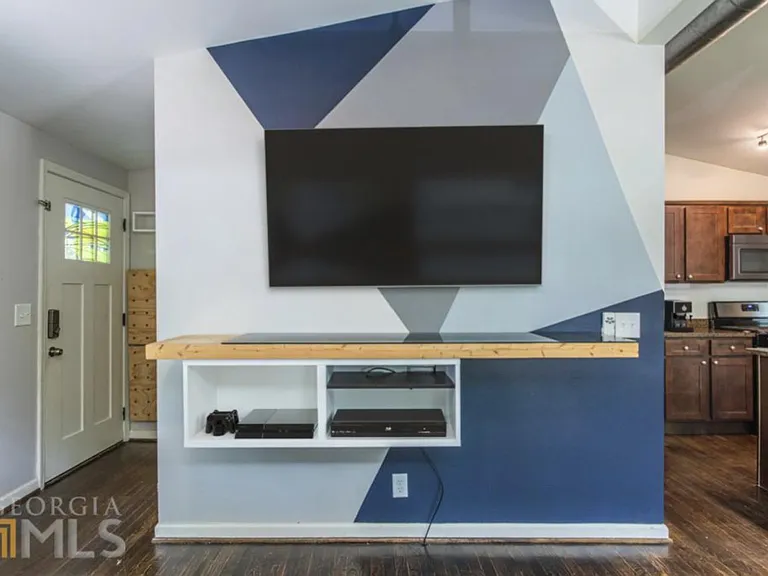 Virtually staged living room. All interior walls have recently been painted white for future tenant.