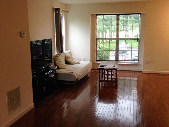 The family room has a hardwood floor.