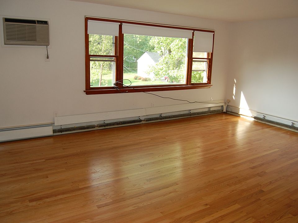 Living Room w/ refinished HW flrs and AC