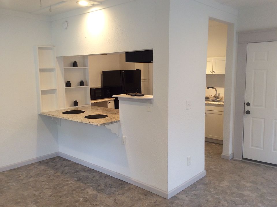Entry at living, Closet storage right of kitchen