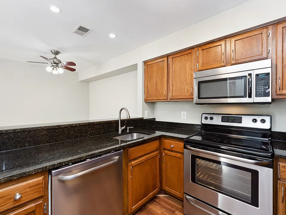 Updated kitchen with stainless steel appliances and granite