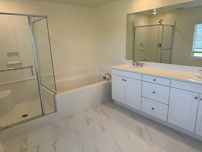 View of upstairs main bathroom with separate shower, soaking tub and separate toilet room.

New upgraded, tile flooring.
