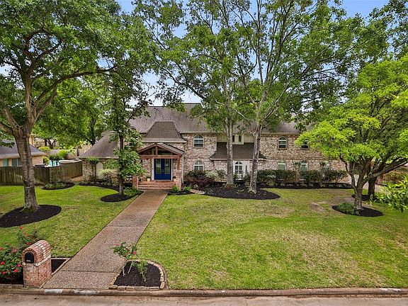 OVERSIZED LOT ; This home sits on an oversized lot with mature trees, beautiful landscaping, and large covered front porch.